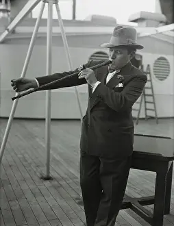 Stunt Prints: Cartoonist Robert Ripley Lighting his Pipe