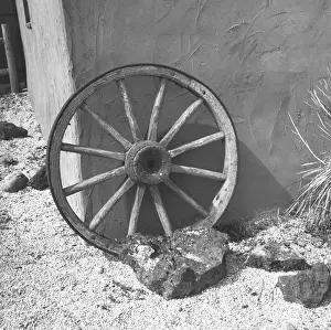 Plaster Prints: Cartwheel leaning by wall, (B&W)