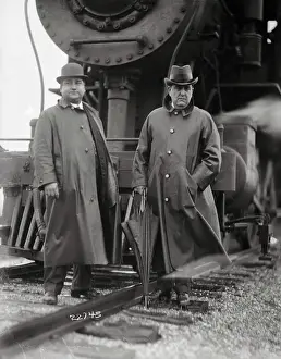 Garden City Prints: Casali and Regan Posing In Front of Steam Engine