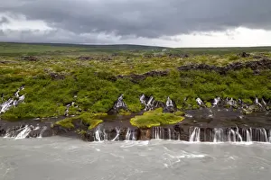 Cascades of water from nearby glaciers flowing into Hvita River, Hraunfossar Falls, Borgarfjordur, West Iceland, Iceland