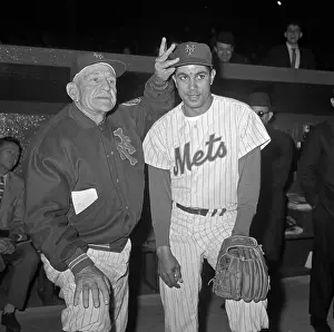 Casey Stengel Adjusting Cap of New Mets Team Player