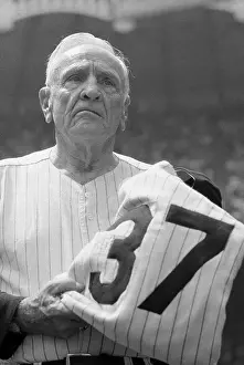 Casey Stengel Holding His Baseball Uniform