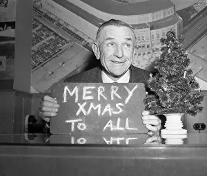 Casey Stengel Holding Sign Stating Merry Xmas to All