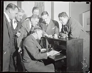 Casey Stengel Sitting at Desk and Surrounded by Friends