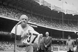Casey Stengel Standing at Microphone with His Jersey