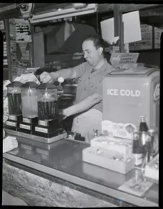 Assassination Prints: Cashier Pouring Drink In Soda Shop