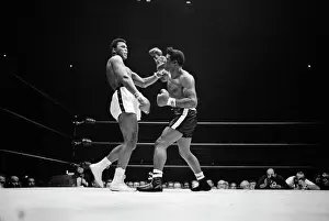 Cassius Clay Brushing Off Punches