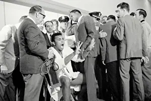 Cassius Clay Holding up Eight Fingers