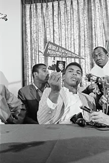 Maine Prints: Cassius Clay Holding up Photos of Wallace Fard Muhammad