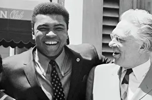 Cassius Clay Laughing with Attorney Hayden Covington
