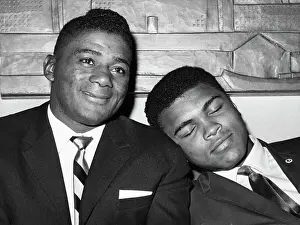 Cassius Clay Napping on Floyd Patterson's Shoulder