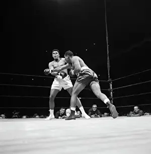 Cassius Clay and Opponent in Action
