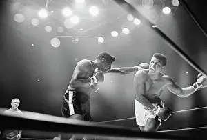 Cassius Clay Snarling at Floyd Patterson