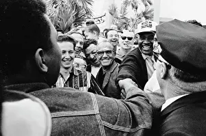 Cassius Clay and Sonny Liston Shaking Hands in Crowd