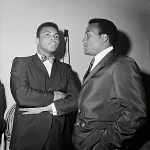 Cassius Clay Stands with Jim Brown in Suit