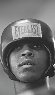 Prints of LOS ANGELES, CA - OCTOBER, 1962: Cassius Clay, between training sets at the Main Street Gym preparing for his bout against Archie Moore, October, 1962 in Los Angeles, California In the Ring: The Art of Boxing: Cassius Clay Training