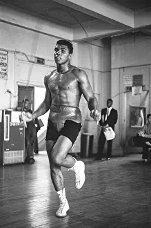 Prints of LOS ANGELES, CA - OCTOBER, 1962: Cassius Clay, is jumping rope, training, at the Main Street Gym for his bout against Archie Moore in October, 1962 in Los Angeles, California In the Ring: The Art of Boxing: Cassius Clay Training