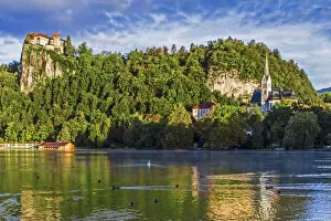 Castle rises on cliffs above Lake Bled, Slovenia