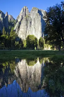 Yosemite National Park Prints: Cathedral Rocks are reflected in a pool of water in Yosemite National Park, CA