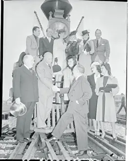 Cecil B. Demille and Actors Posing on Train