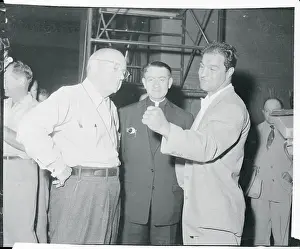 Cecil B. DeMille Conversing With Rocky Marciano and Priest