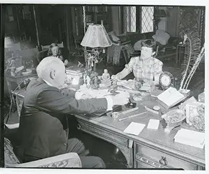 Cecil B Prints: Cecil B. DeMille in His Office With Secretary