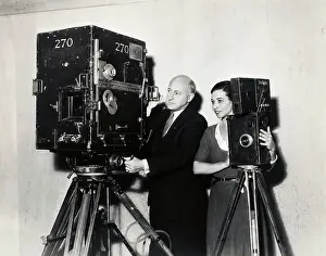 Cecil B. DeMille with Old and New Movie Cameras