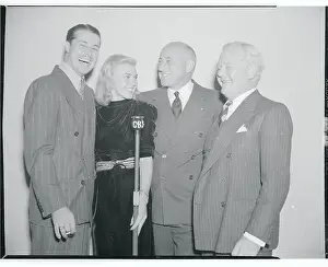 Cecil B Prints: Cecil B. DeMille Posing With Actors at CBS Microphone