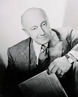 Cecil B Prints: Cecil B. DeMIlle Posing With Script