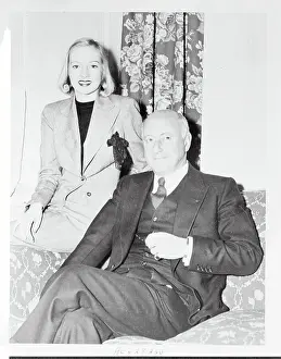 Cecil B Prints: Cecil B. DeMille Sitting Next to Actress Evelyn Keyes