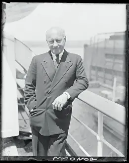 Cecil B Prints: Cecil B. Demille Standing on a Boat Deck