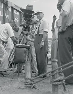Cecil B. Demille Standing in Front of a Movie Camera