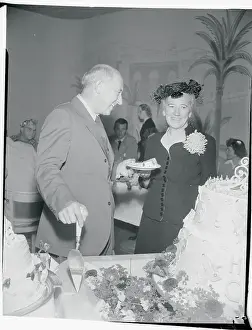 Cecil B. DeMille and Wife Celebrating With Birthday Cake