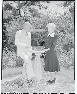 Cecil B. DeMille and Wife Standing at Outside Fountain