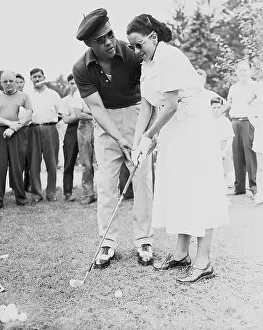 The Champ Teaches His Wife to Putt
