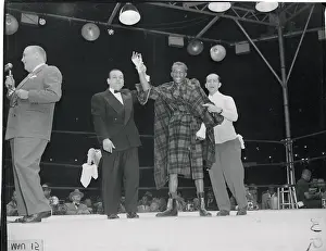 Champion Sandy Saddler and Opponent After Boxing Event