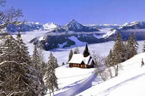 Chapel in winter with view on the Hochflue and the Central Swiss Alps, Haggenegg, Canton of Schwyz, Switzerland