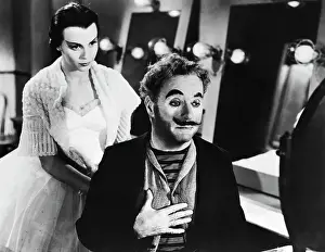 Prints of (Original Caption). Movie still from Limelight, 1951, showing Charles Chaplin and Claire Bloom Master of Mime, Icon of Cinema: Chaplin in Prints: Charles Chaplin & Claire Bloom