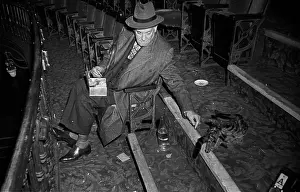 Prints of 20th July 1946: Theatre producer Charles Blake Cochran (1872 - 1951) feeding the Adelphi Theatre cat during a rehearsal A Glimpse into the Past: Charles Cochran