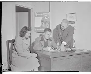 Port Washington Prints: Charles E. Stanley Working at His Desk with Assistants