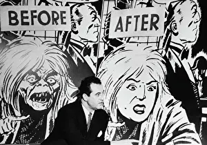 Charles F Prints: Charles F. Murphy Sitting in Front of Comic Visual Display