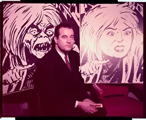 Charles F. Murphy Sitting in Front of Large Posters