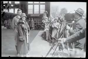 Charles Lindbergh Posing With His Mother in Front of Cameras