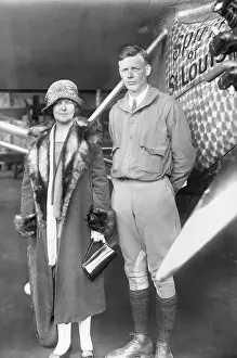 Charles Lindbergh Posing With His Mother Near Airplane