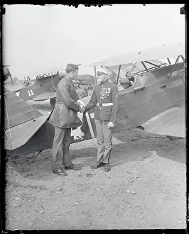 Charles Lindbergh Shaking Hand of Marine Near Airplane