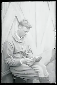 Charles Lindbergh Sitting and Reading Mail