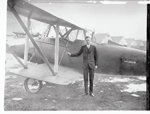 Charles Lindbergh Standing Next to Airplane