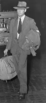 Charles Lindbergh Wearing Suit and Carrying Luggage