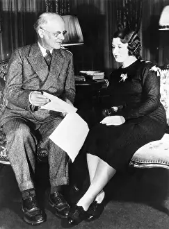 Store Prints: Charles R. Walgreen Going over Paperwork with His Niece