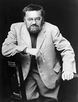 Charles Steinmetz Smokes Kneels On Chair